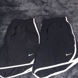 2 pairs of black nike shorts